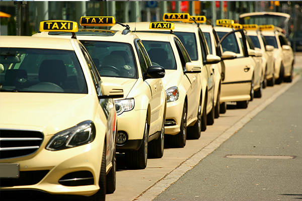 An image of a line of new taxis